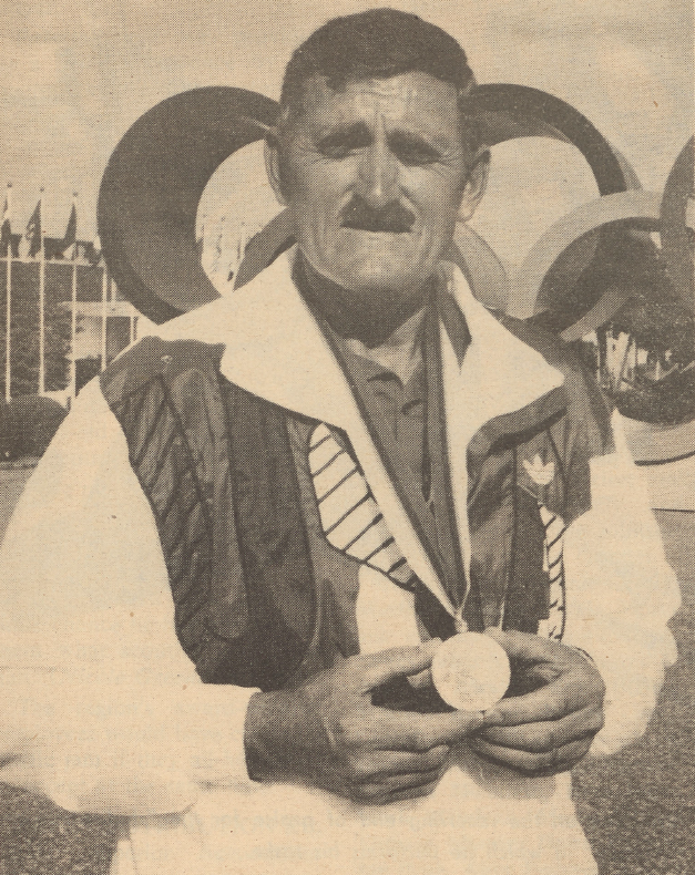 Erich Buljung with 1988 Olympics medal.