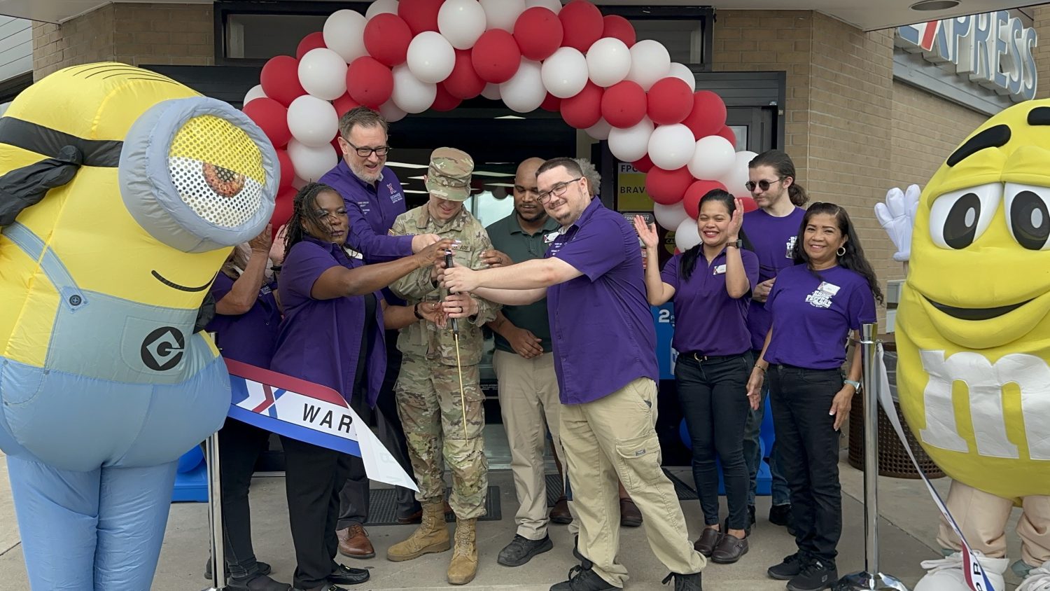 Exchange leaders and a Fort Cavazos Soldier cut the ribbon on the renovated Warrior Way Express.