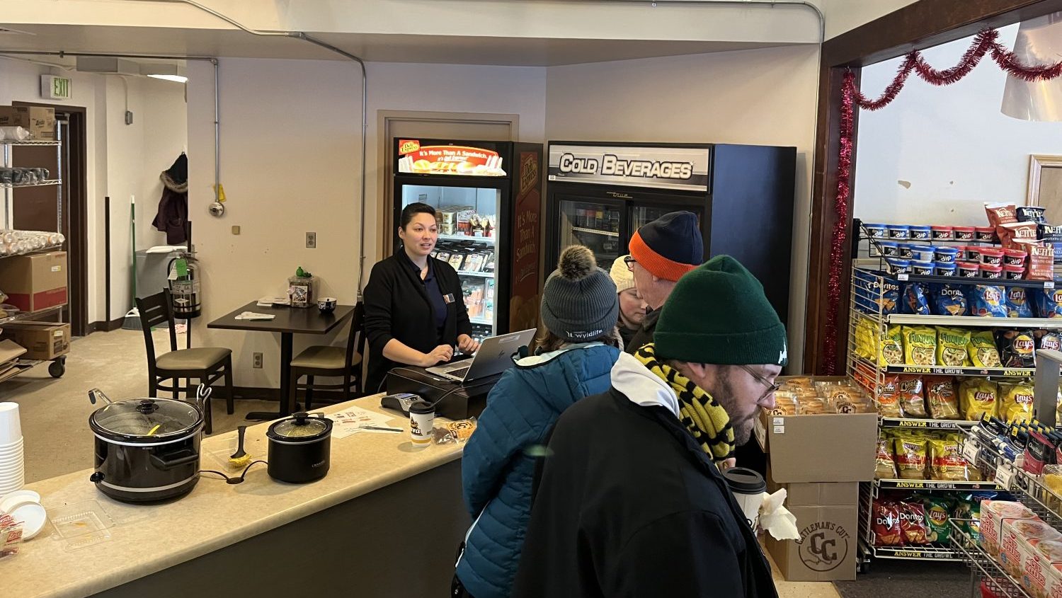 Joint Base Elmendorf-Richardson associate Kryzia Ceja at the Hillberg Ski Area snack bar cash register.