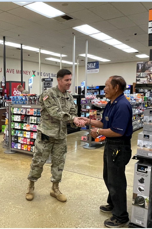 Col. Samuel Kline, garrison commander of Presidio of Monterey, thanks 55-year Exchange associate Richard Alonzo for his service.