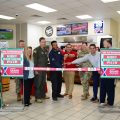 Exchange, installation and Hunt Brothers Pizza leaders cut the ribbon at the new Hunt Brothers at Yokota Air Base.