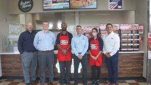 Photo of Exchange and Hunt Brothers Pizza leaders at Hunt Brothers Pizza at the Sagamihara Housing Area Express on Camp Zama.