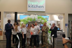 Exchange leaders, JB Andrews leaders and celebrity chef Robert Irvine cut the ribbon on Fresh Kitchen at the JB Andrews Exchange.