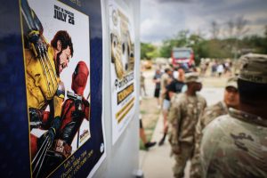 Troops in Romani line up for a screening of "Deadpool & Wolverine"