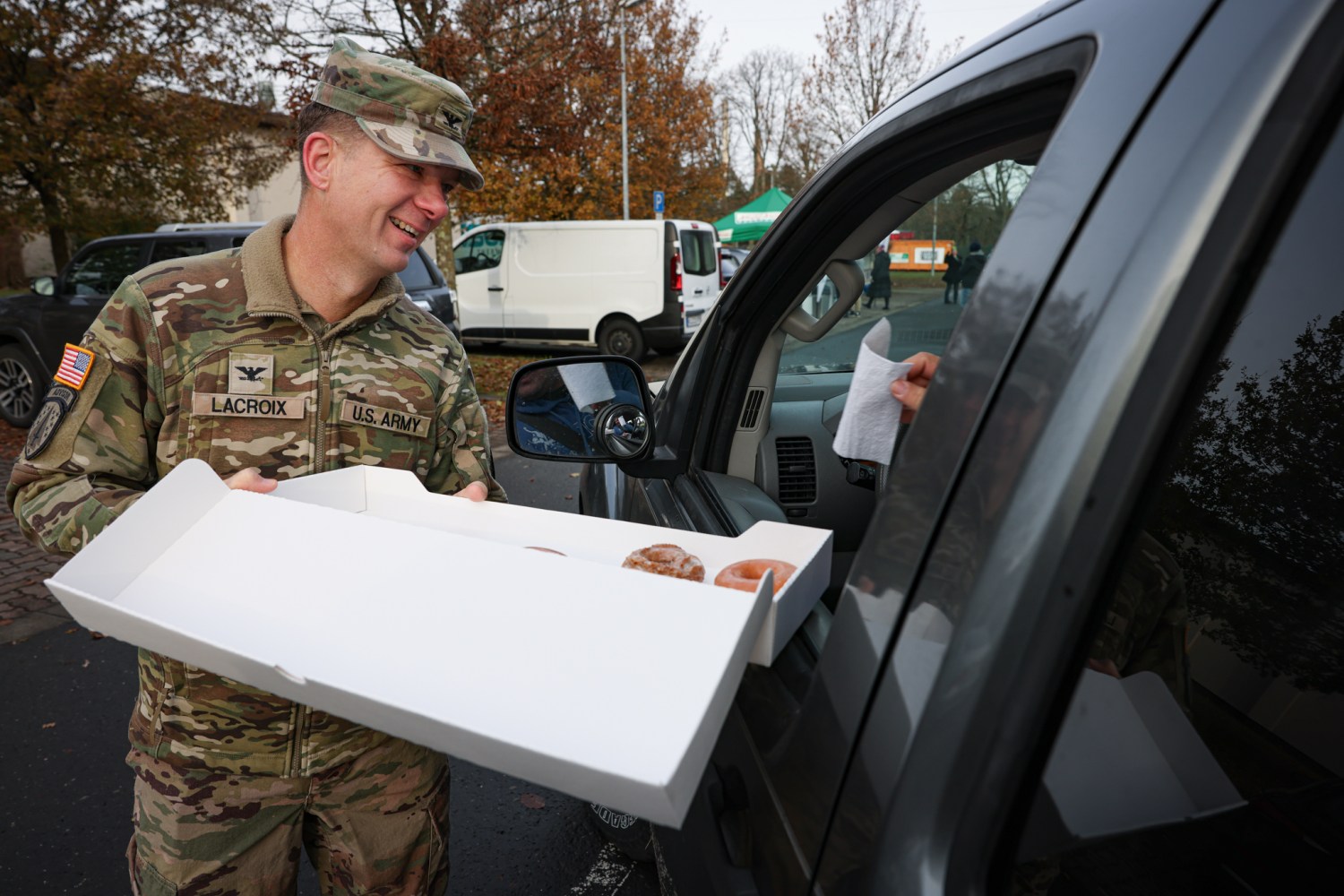 The Exchange supported the USO during a Thanksgiving meal giveaway for junior enlisted service members behind the Vogelweh, Germany commissary on 23 November 2024.