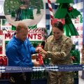 Four people cut the ribbon on the Bath & Body Works at the Joint Base Andrews Exchange.